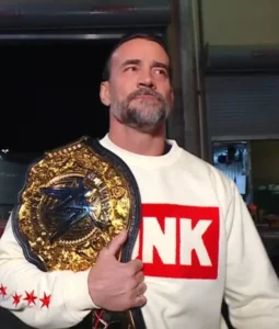 CM Punk WWE 2025 RAW World Heavyweight Champion Cream Crewneck Sweatshirt with White and Red Logo Detailing
